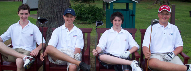 boys-sitting-in-chairs-holding-clubs