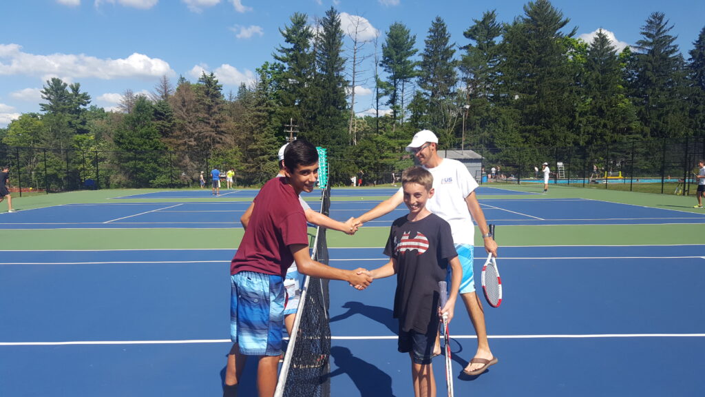 shaking-hands-over-tennis-net