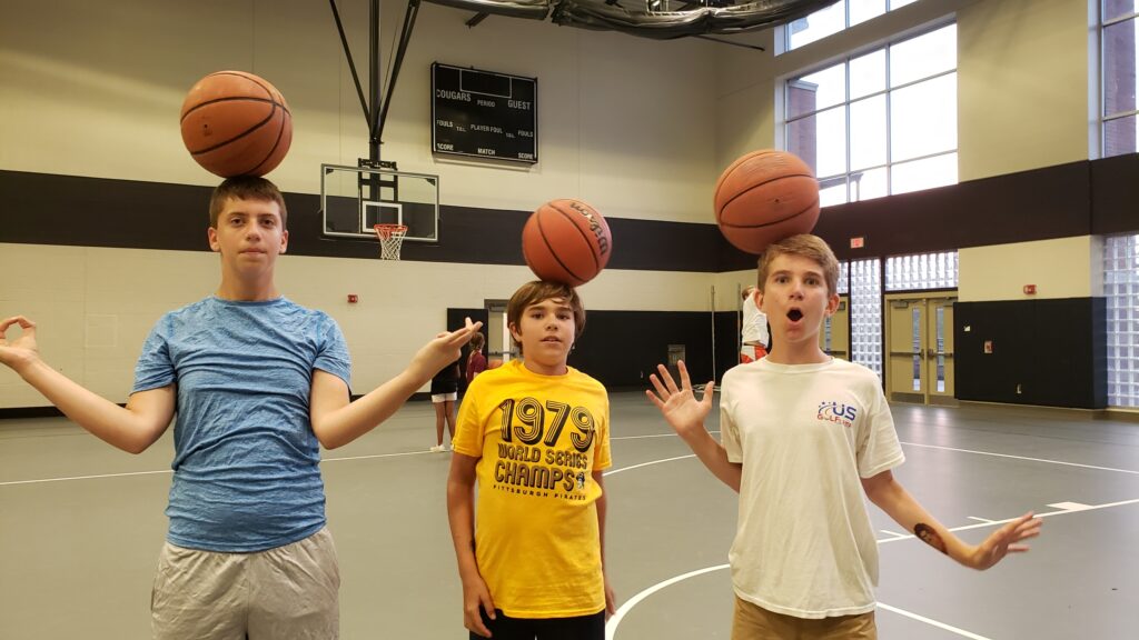 kids-balancing-basketballs-on-head